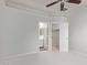 Spacious bedroom with ceiling fan, walk-in closet, and ensuite bathroom at 16818 S 23Rd St, Phoenix, AZ 85048