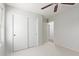 Bright bedroom featuring a fan and ample closet space at 16818 S 23Rd St, Phoenix, AZ 85048