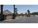 Inviting entrance to Desert Foothills Villas with gated access and mature landscaping at 16818 S 23Rd St, Phoenix, AZ 85048