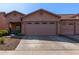 Charming home featuring a two-car garage and well-manicured desert landscaping in front at 16818 S 23Rd St, Phoenix, AZ 85048