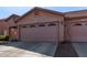 Charming home featuring a two-car garage and well-manicured desert landscaping in front at 16818 S 23Rd St, Phoenix, AZ 85048