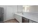 Bright kitchen featuring white cabinets, stainless steel appliances, and modern sink at 16818 S 23Rd St, Phoenix, AZ 85048