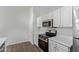 Bright kitchen featuring stainless steel appliances and white cabinets with plenty of storage space at 16818 S 23Rd St, Phoenix, AZ 85048