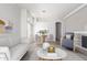 Bright living room with hardwood floors, white walls, and modern furnishings at 16818 S 23Rd St, Phoenix, AZ 85048