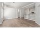 Open living area with hardwood floors and white walls adjacent to the kitchen at 16818 S 23Rd St, Phoenix, AZ 85048