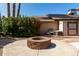 Backyard features a stone fire pit, shed, and lush landscaping in a private setting at 18610 N 45Th Ave, Glendale, AZ 85308