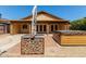 A spacious backyard features a hot tub, a stone fire pit and a covered patio at 18610 N 45Th Ave, Glendale, AZ 85308