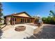 This home's backyard features a stone fire pit and covered patio, great for entertaining at 18610 N 45Th Ave, Glendale, AZ 85308