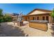 The backyard features a hot tub, a stone fire pit and a covered patio at 18610 N 45Th Ave, Glendale, AZ 85308