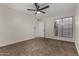Bright bedroom with ceiling fan, door, and window; offering both comfort and natural light at 18610 N 45Th Ave, Glendale, AZ 85308