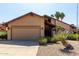 Charming single-story home with a two-car garage and desert landscaping at 18610 N 45Th Ave, Glendale, AZ 85308