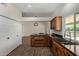 Open kitchen featuring updated cabinets, granite countertops, stainless steel appliances, and a large window at 18610 N 45Th Ave, Glendale, AZ 85308