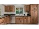 Updated kitchen with stainless steel appliances, custom cabinets, and granite countertops at 18610 N 45Th Ave, Glendale, AZ 85308
