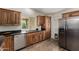 Updated kitchen with stainless steel appliances, granite countertops, and wood cabinets at 18610 N 45Th Ave, Glendale, AZ 85308