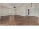 Spacious living room featuring vaulted ceilings, a ceiling fan, and sliding glass doors at 18610 N 45Th Ave, Glendale, AZ 85308