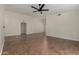 Spacious living room featuring vaulted ceilings, a ceiling fan, and neutral paint at 18610 N 45Th Ave, Glendale, AZ 85308