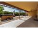 A covered patio features a hot tub, lush landscaping and a fire pit at 18610 N 45Th Ave, Glendale, AZ 85308