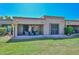 Exterior view of the backyard and covered patio with furniture at 19120 N 98Th Ln, Peoria, AZ 85382
