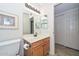 Bathroom featuring a vanity with sink, a mirror, and a toilet at 19120 N 98Th Ln, Peoria, AZ 85382