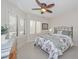 Bright bedroom with large windows and comfortable bed at 19120 N 98Th Ln, Peoria, AZ 85382