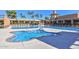 Stunning community pool with a splash pad and ample seating at 19120 N 98Th Ln, Peoria, AZ 85382