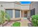 Charming front entrance with desert landscaping and a security screen door at 19120 N 98Th Ln, Peoria, AZ 85382