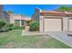Charming single-story home featuring a tile roof, stucco exterior, and a well-maintained front yard with green grass at 19120 N 98Th Ln, Peoria, AZ 85382