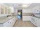 Well-lit kitchen featuring granite countertops, white cabinets, and modern appliances, perfect for cooking and entertaining at 19120 N 98Th Ln, Peoria, AZ 85382