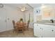 Bright breakfast nook with a ceiling fan and a cozy table at 19120 N 98Th Ln, Peoria, AZ 85382