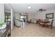 Open concept living area featuring tile floors and a dining area at 19120 N 98Th Ln, Peoria, AZ 85382