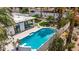 Aerial shot of backyard oasis complete with a sparkling pool, lounge chairs, and manicured lawn at 1925 E Lane Ave, Phoenix, AZ 85020