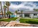 Expansive backyard with a sparkling pool, lounge chairs, and a covered patio, perfect for outdoor living at 1925 E Lane Ave, Phoenix, AZ 85020