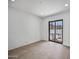 Bedroom with tile floors and a sliding glass door opening to the pool area at 1925 E Lane Ave, Phoenix, AZ 85020