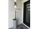 A modern residence with a desert-style plant pot positioned next to the front door at 1925 E Lane Ave, Phoenix, AZ 85020