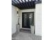 Modern double front door with decorative cactus planters enhancing the home's curb appeal at 1925 E Lane Ave, Phoenix, AZ 85020