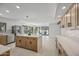 Bright and spacious kitchen features a large island, stainless steel appliances, and views of the backyard pool at 1925 E Lane Ave, Phoenix, AZ 85020