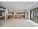 Spacious kitchen with stainless steel appliances, central island, and sliding glass doors to the backyard at 1925 E Lane Ave, Phoenix, AZ 85020