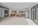 Spacious kitchen with stainless steel appliances, central island, and sliding glass doors to the backyard at 1925 E Lane Ave, Phoenix, AZ 85020