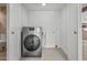 Laundry room featuring tile floors and stainless steel appliances at 1925 E Lane Ave, Phoenix, AZ 85020