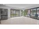 Bright living room featuring tile flooring, stainless steel refrigerator, and sliding doors to the backyard at 1925 E Lane Ave, Phoenix, AZ 85020