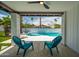 Relaxing patio area with ceiling fan, views of the pool, and comfortable seating for outdoor enjoyment at 1925 E Lane Ave, Phoenix, AZ 85020