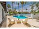 Relaxing pool area with patio seating, creating an ideal space for outdoor entertaining at 1925 E Lane Ave, Phoenix, AZ 85020