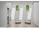 Cozy seating area, with hanging plants, creates a relaxing space next to a full bathroom at 1925 E Lane Ave, Phoenix, AZ 85020