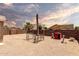 Desert landscaped backyard is a clean slate with charming features like a pergola at 1943 E San Tan St, Chandler, AZ 85225
