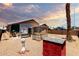 Private backyard featuring desert landscaping, a cozy porch swing and pergola at 1943 E San Tan St, Chandler, AZ 85225