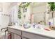 Bathroom features double sinks and a framed mirror at 1943 E San Tan St, Chandler, AZ 85225