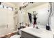 Cozy bathroom features a shower-tub combo, white tile and a decorated vanity at 1943 E San Tan St, Chandler, AZ 85225