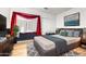 Comfortable bedroom features a queen bed, stylish decor and a large window at 1943 E San Tan St, Chandler, AZ 85225