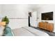 Bright bedroom featuring hardwood floors, a modern dresser and a large window at 1943 E San Tan St, Chandler, AZ 85225