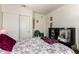 Bedroom featuring a bed with floral bedding, side table and lamp at 1943 E San Tan St, Chandler, AZ 85225